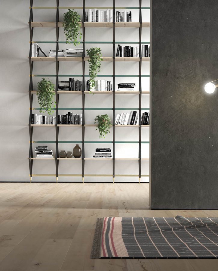 Light colored wood flooring with chair, light fixture, and bookshelf