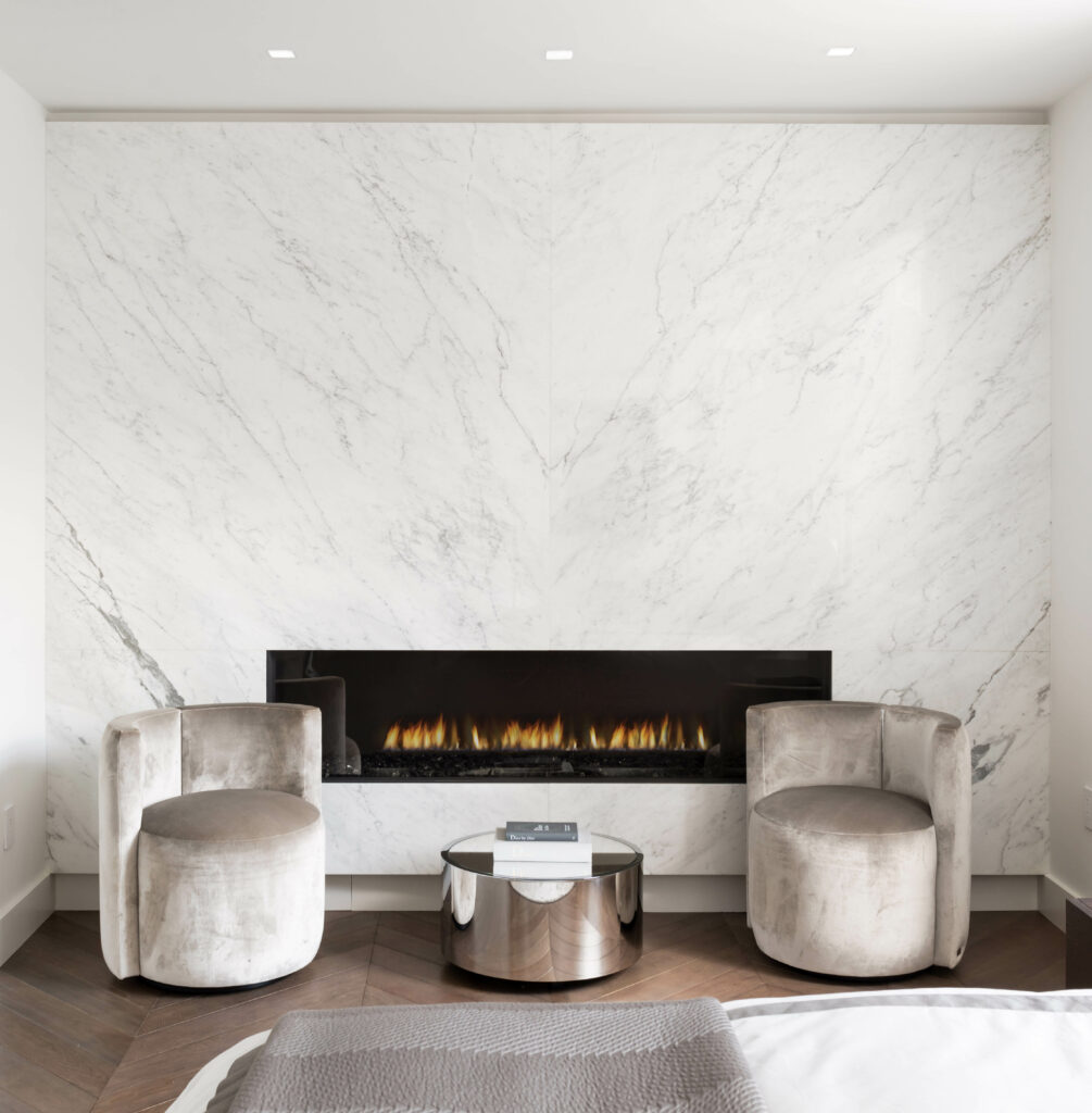 Carrara marble wall and fireplace at luxury Boston condo.