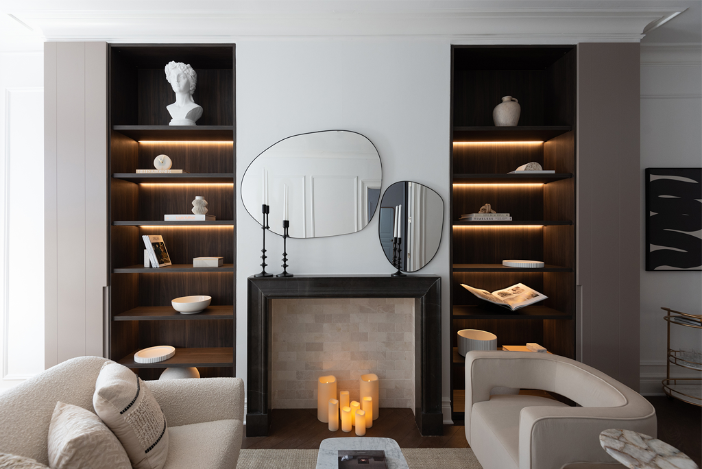 Hand-carved marble mantel and Italian wooden shelves in Back Bay Apartment.