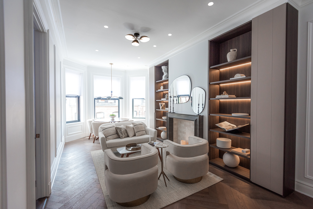 Back Bay living room with hand-carved marble mantel and oak wood flooring.